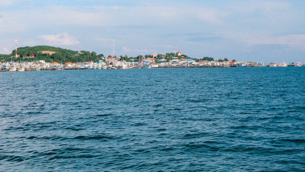 body of water near city buildings during daytime