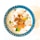 A colorful dessert in a blue ceramic bowl, featuring a mixture of white milky liquid, white jelly-like cubes, orange and green jelly pieces, topped with small brown caramelized coconut bits.