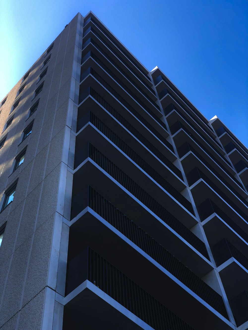 brown concrete building under blue sky during daytime