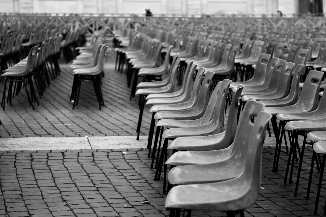 grayscale photo of chair lot