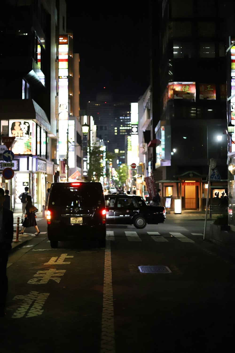 black car on road during night time