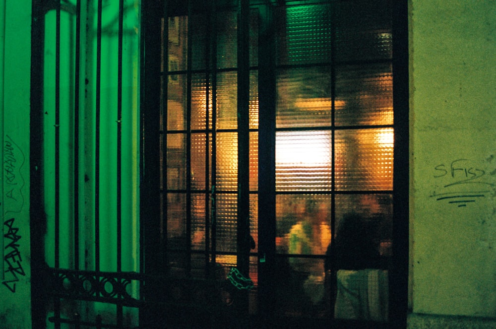 silhouette of person standing near window