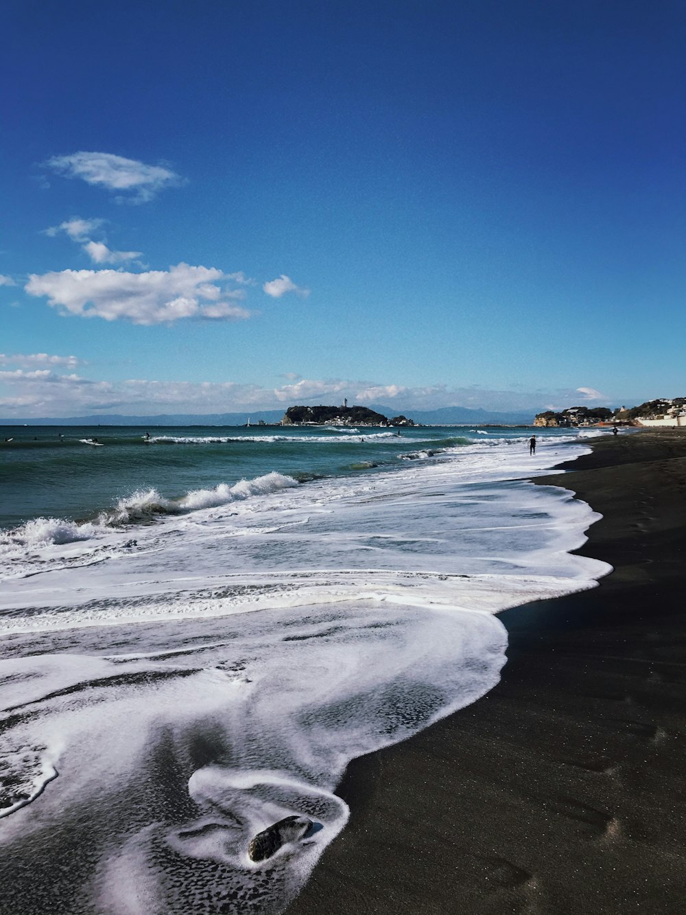 white sand beach during daytime