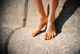 person standing on gray concrete floor
