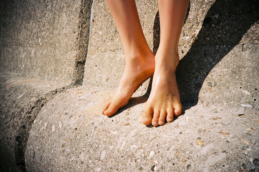 person standing on gray concrete floor