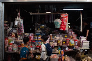 An inviting scene of a cozy shop corner with shelves filled with various imported goods from Japan and Korea.
