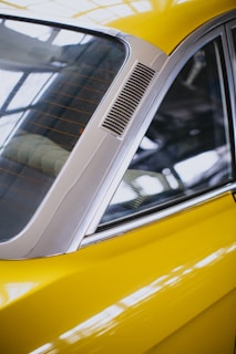 yellow car with silver and black door