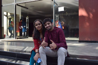 A friendly tenant and property owner chatting happily through the Stezip app on their smartphones.