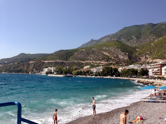 people swimming on beach during daytime in Loutraki Greece