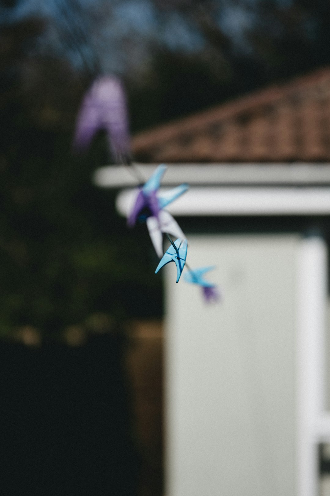 purple and white bird figurine