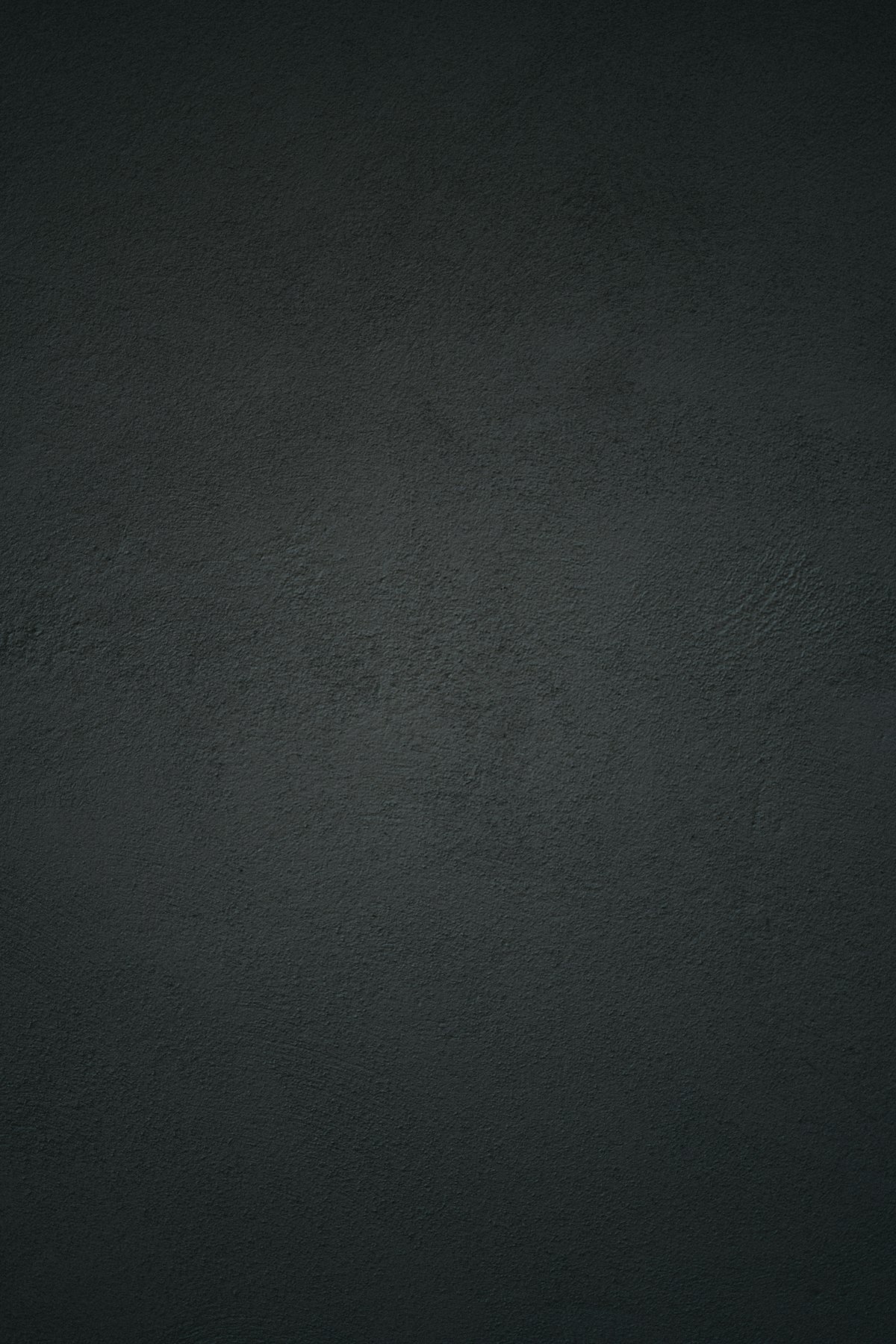 Dominoes falling in a chain reaction against dark background