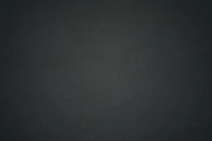 Strong, functional SLS printed component with a matte finish on a dark background.