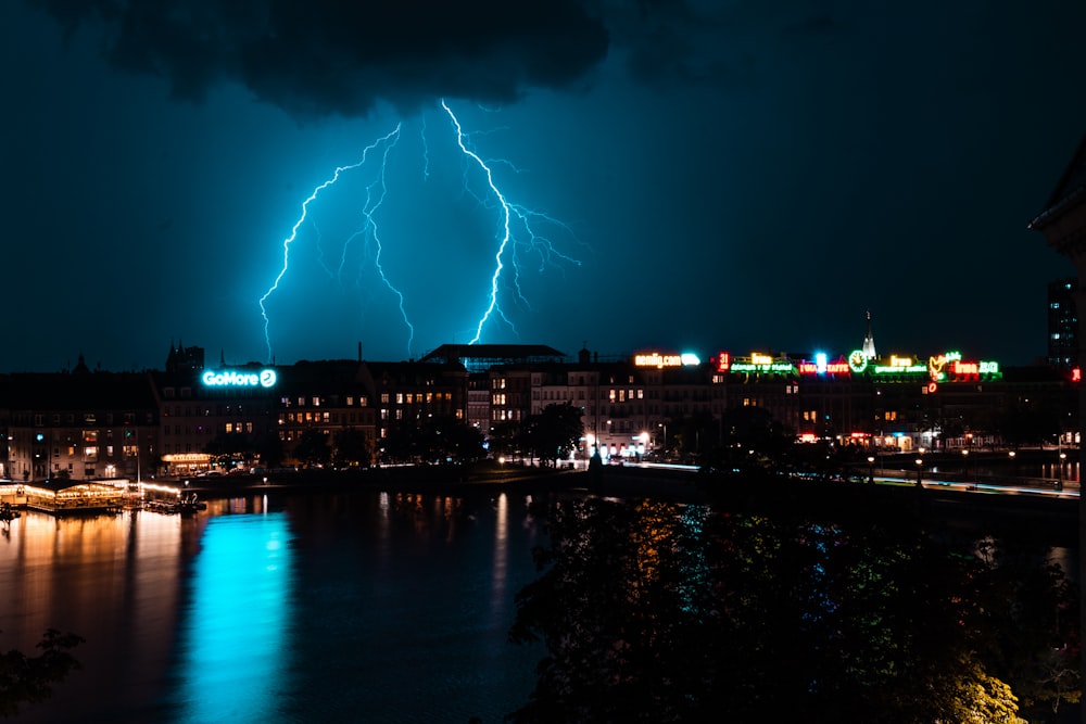 fireworks display over city buildings during night time