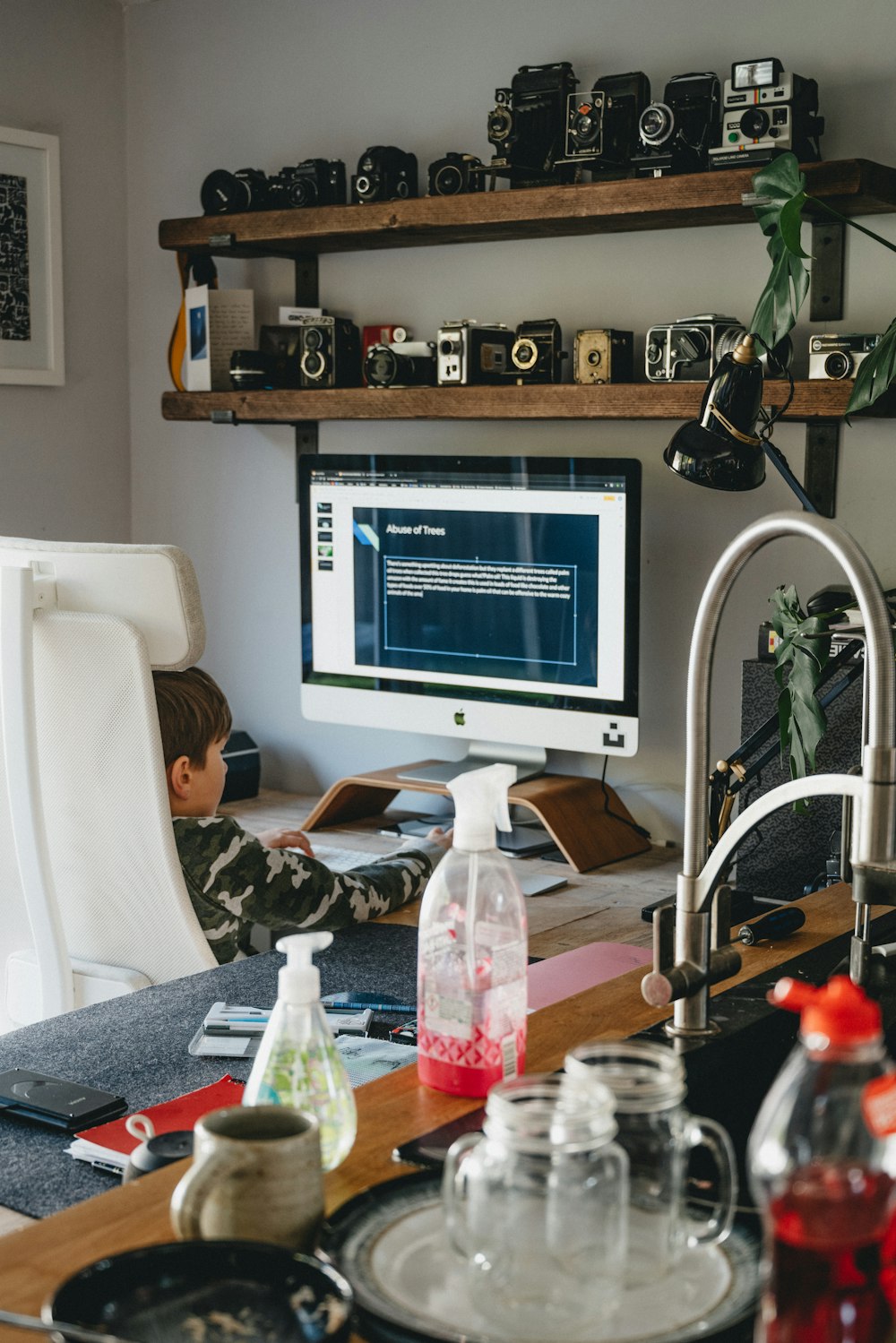 white flat screen computer monitor on brown wooden table