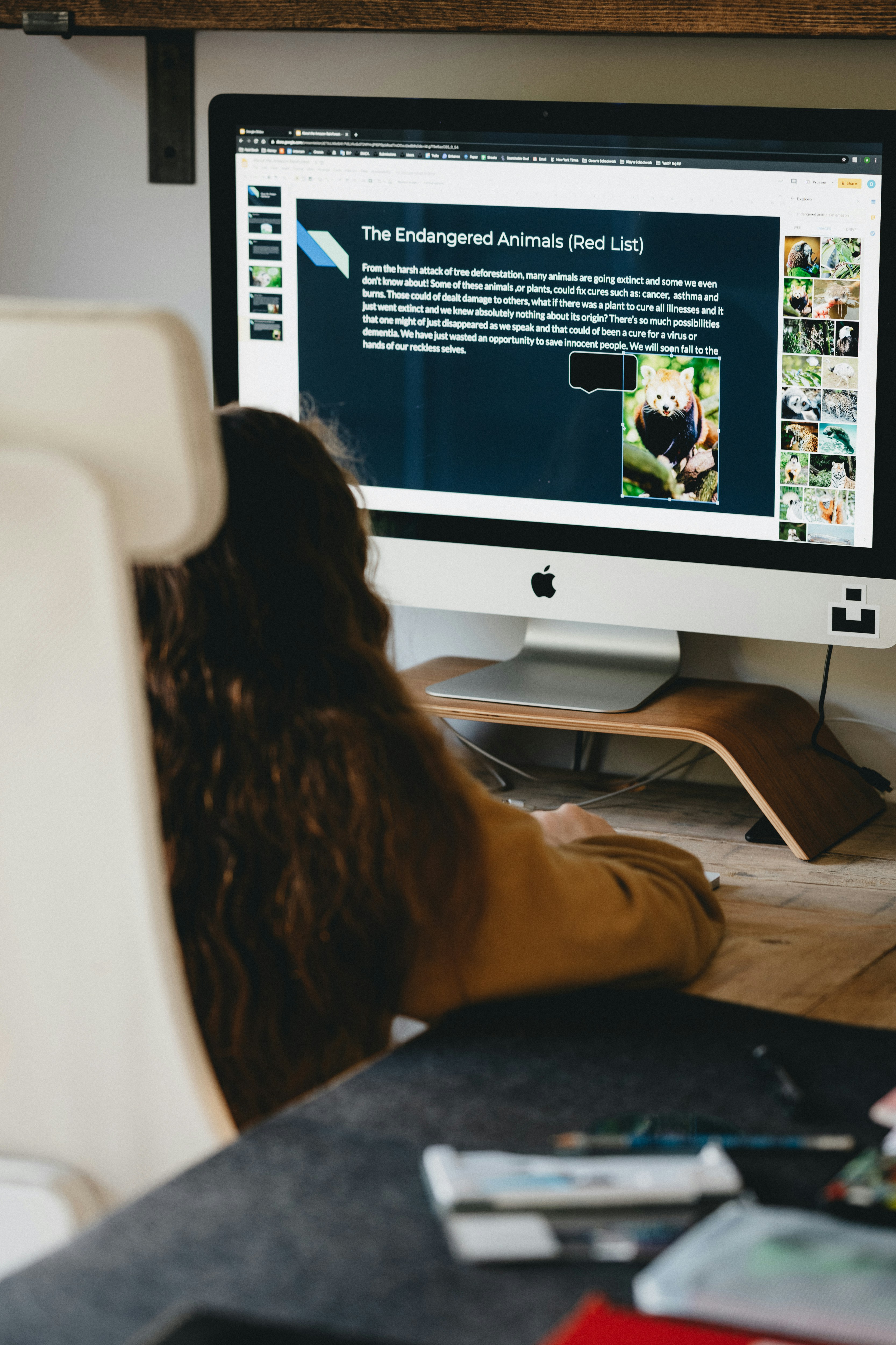 Child completing homework on iMac