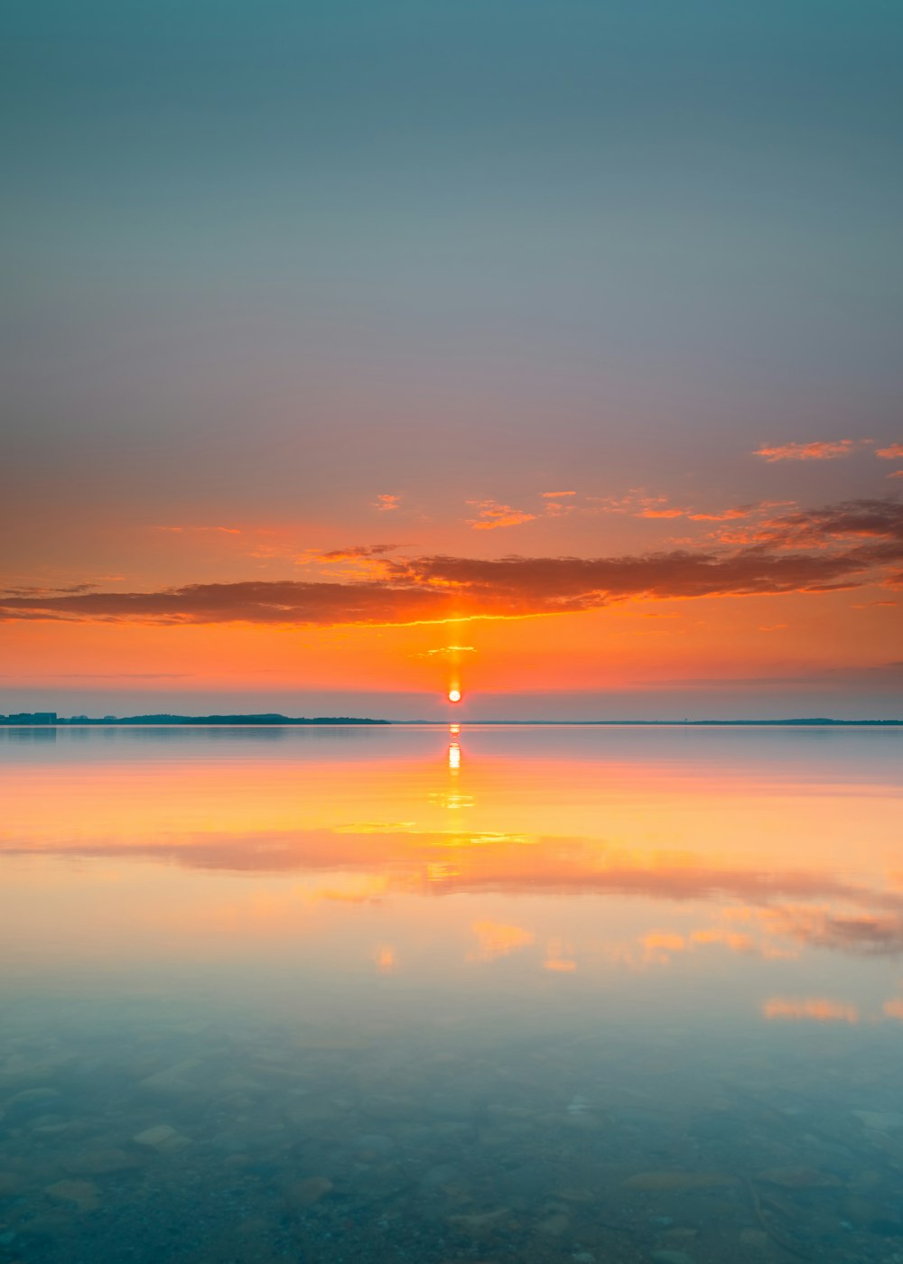 body of water during sunset