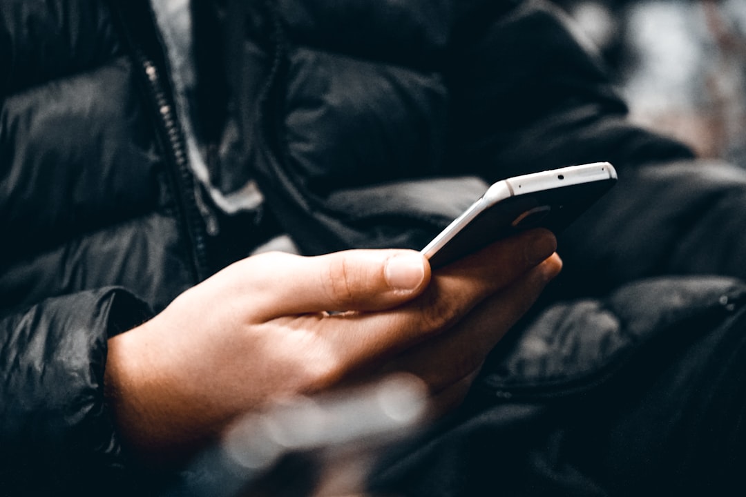 person holding white android smartphone