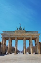 man riding horse statue on top of building