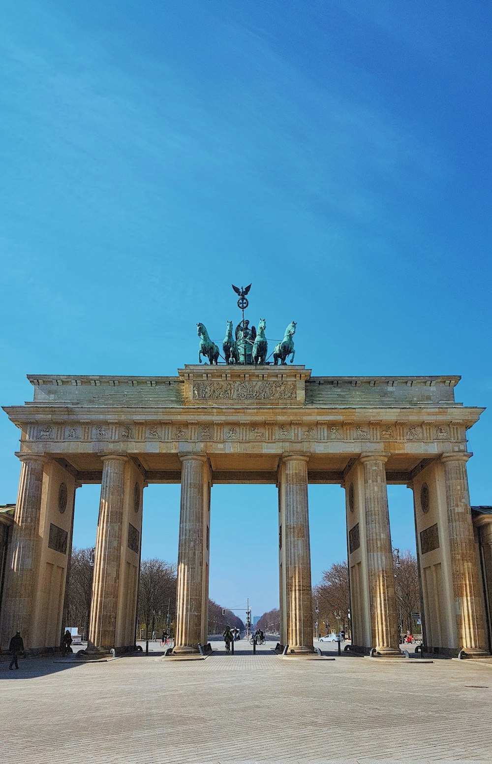 man riding horse statue on top of building