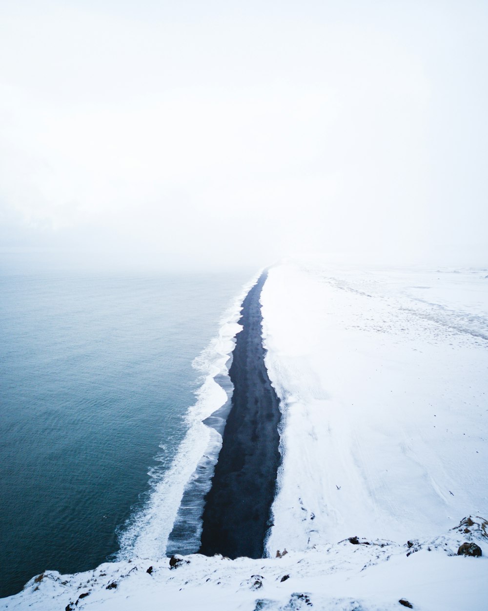 ocean waves crashing on shore during daytime