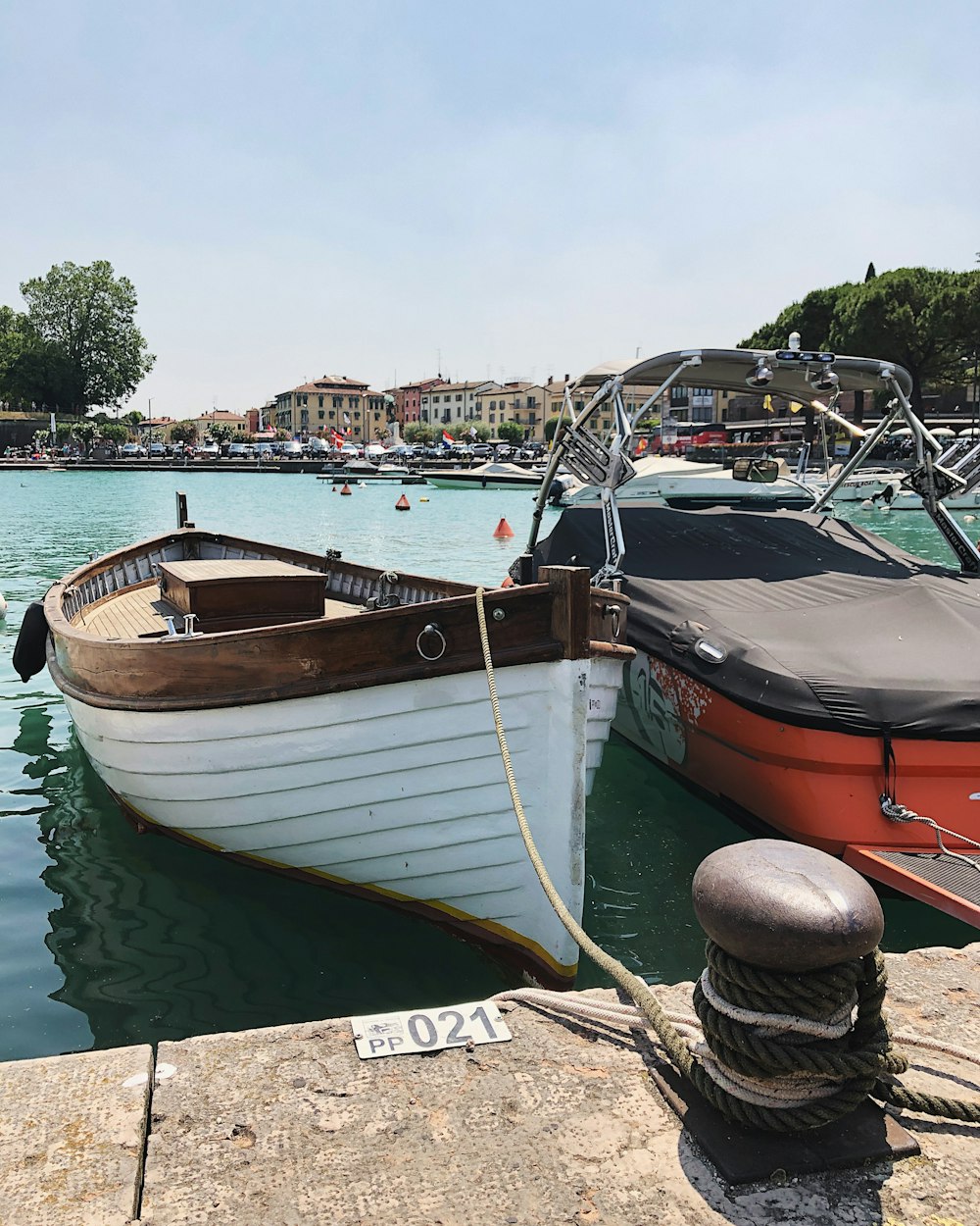 red and white boat on water