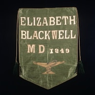 Portrait of Dr. Marie Scott Wilson with a backdrop of flags representing the nations she serves.