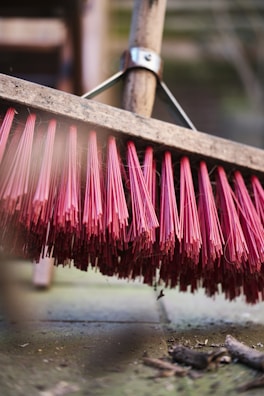 A close-up of a locally crafted broom, showcasing intricate details.