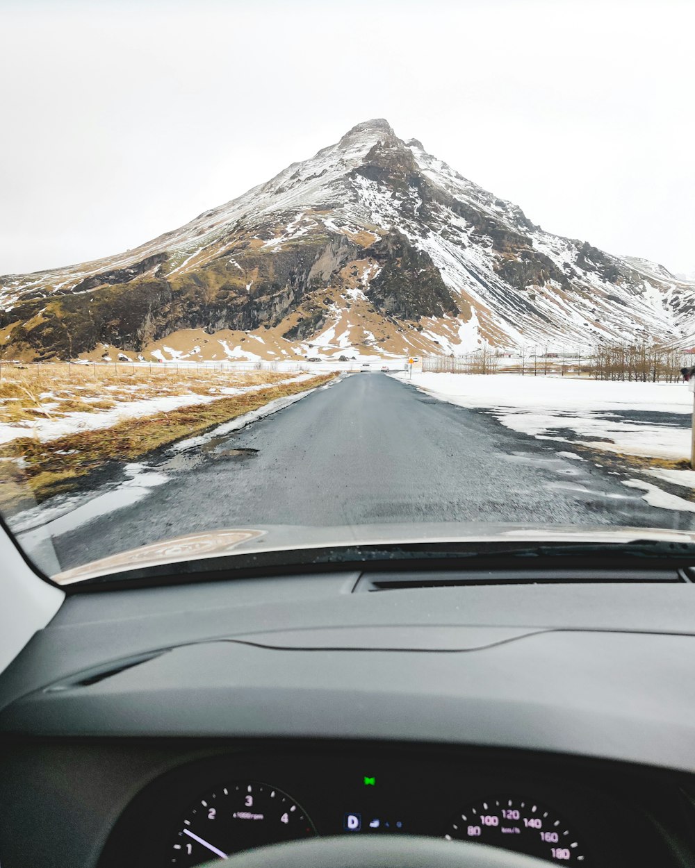 snow covered mountain during daytime