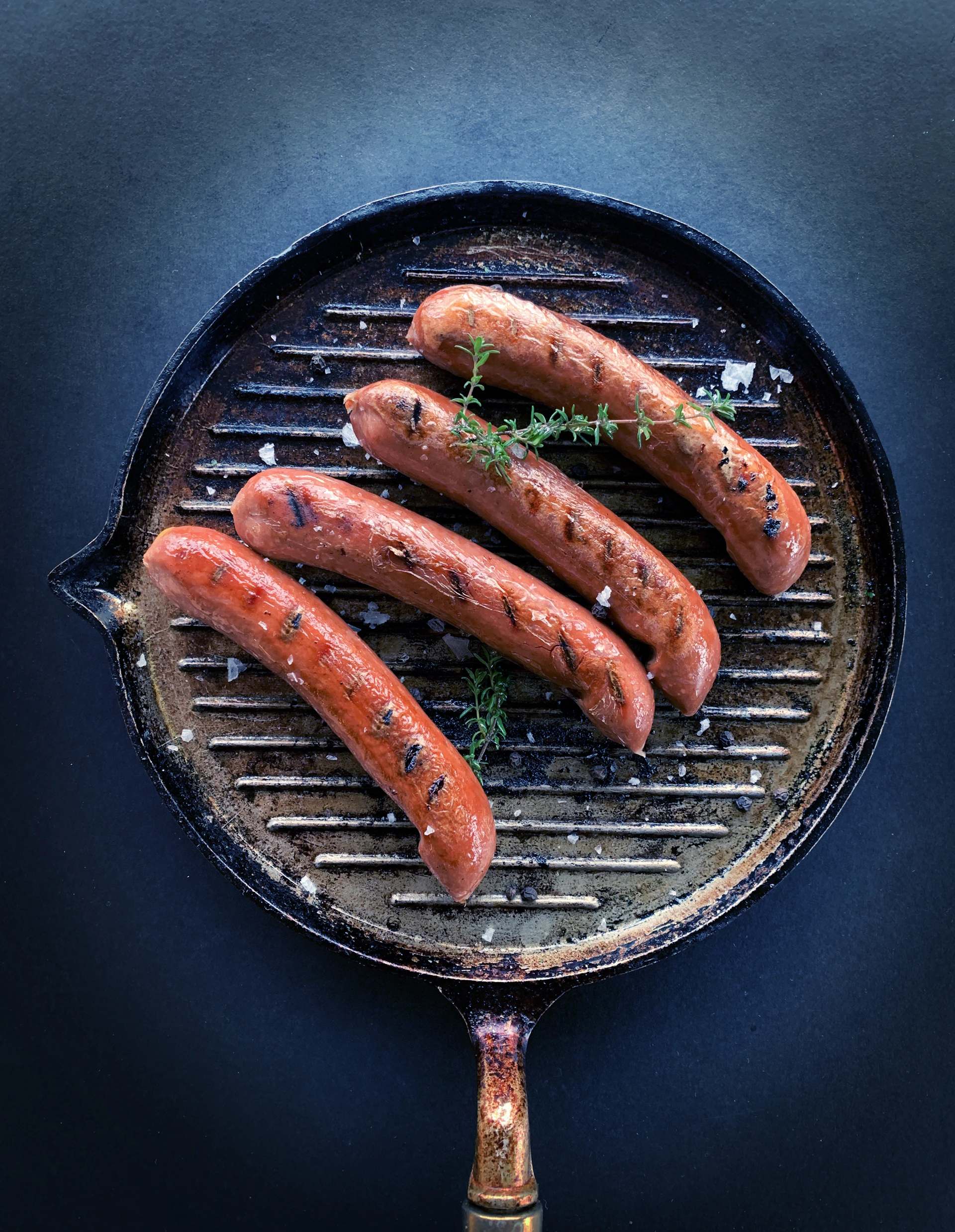 sausage on black round pan
