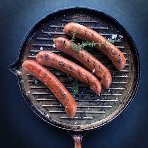 sausage on black round pan