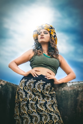 woman in green tank top and black and white skirt