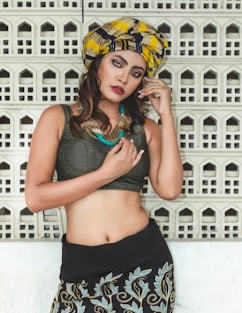 woman in black tank top and yellow cap