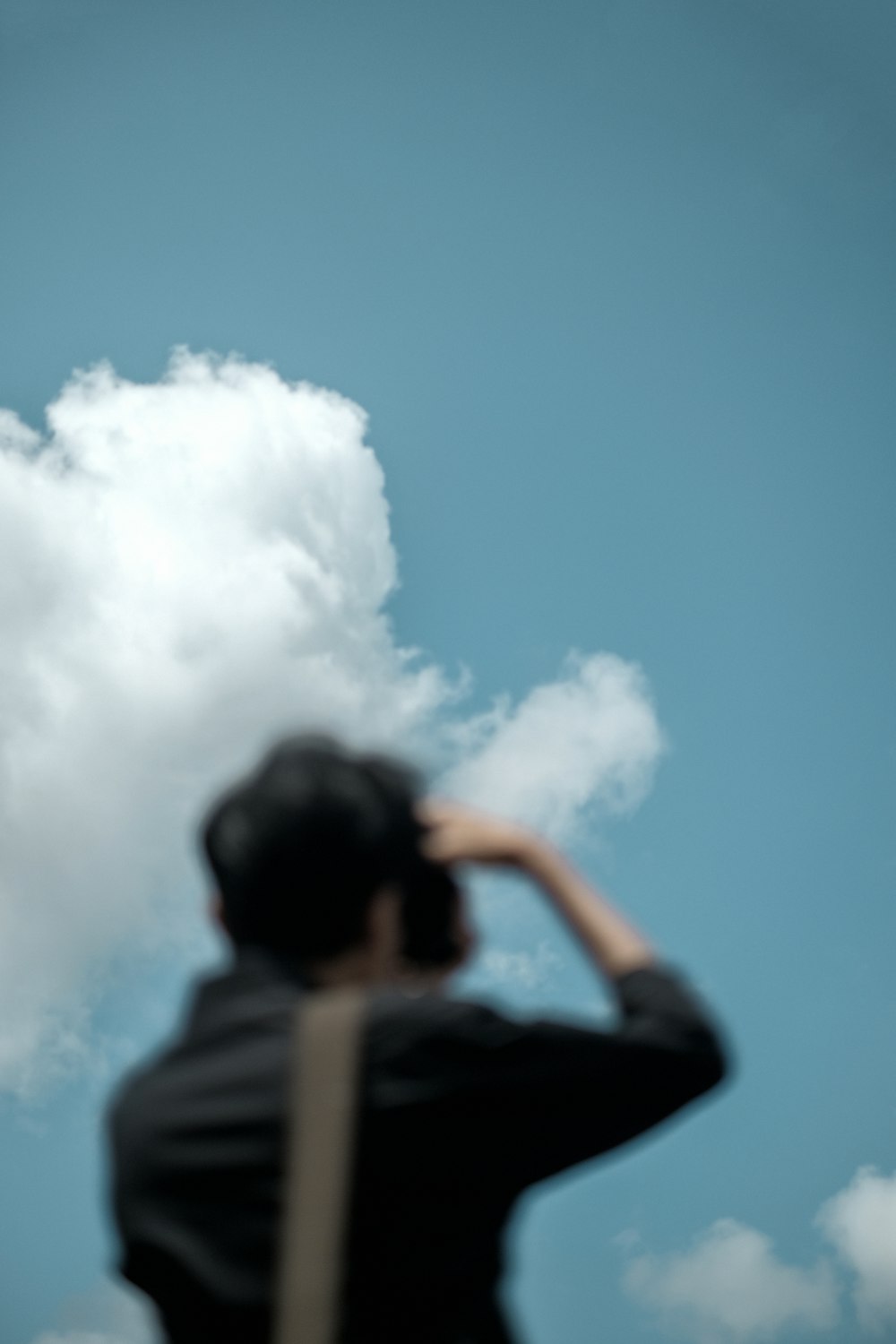 man in black shirt under blue sky during daytime