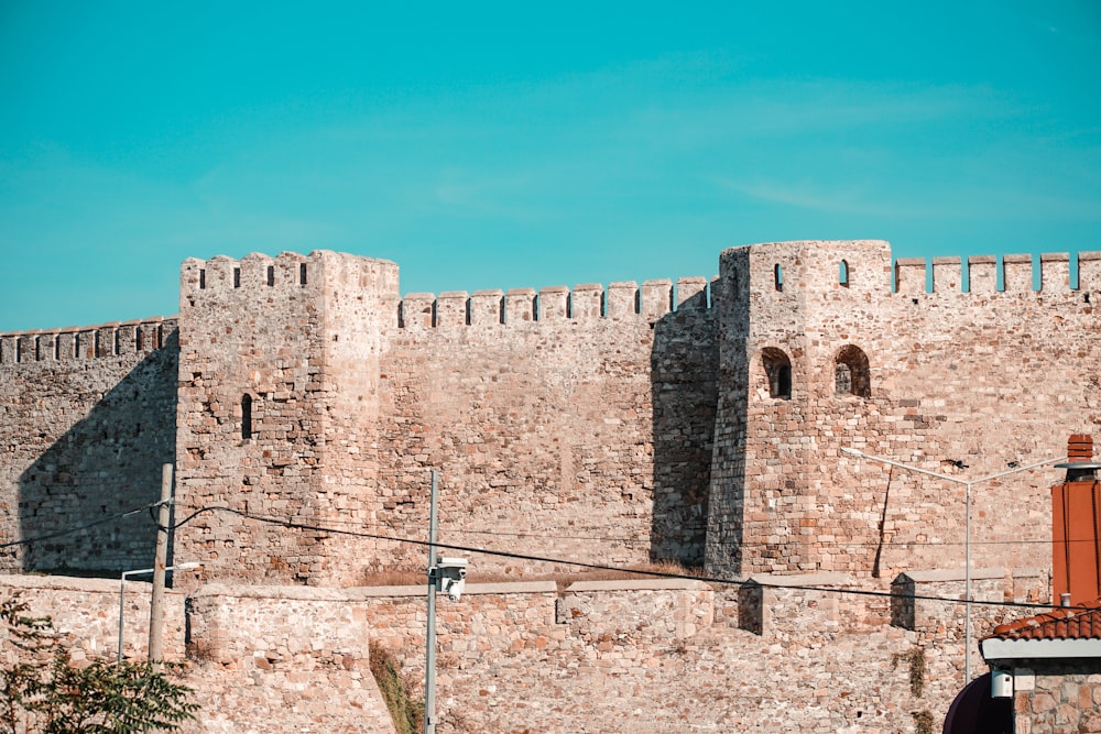 brown brick building under blue sky during daytime