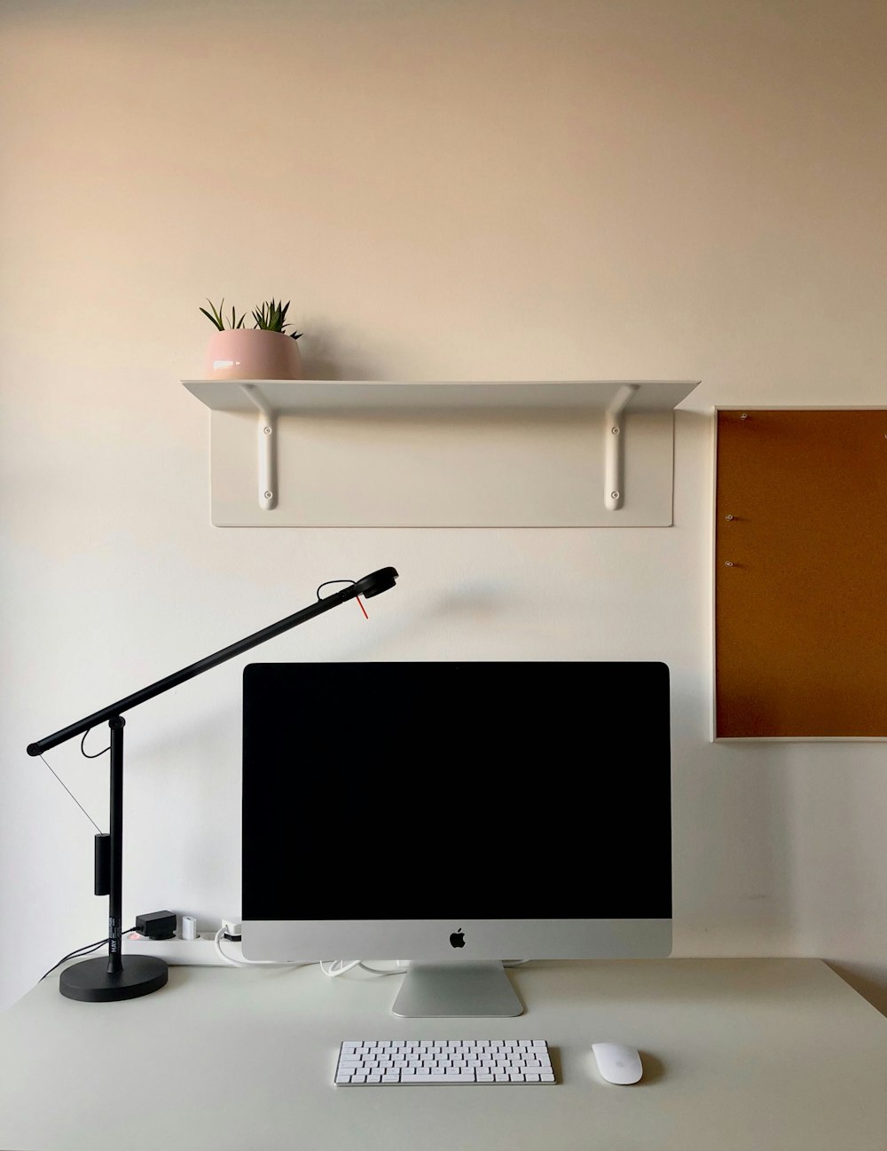 silver imac on white wooden desk