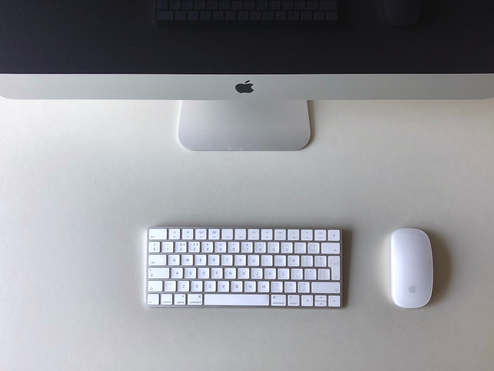 silver imac and apple magic keyboard