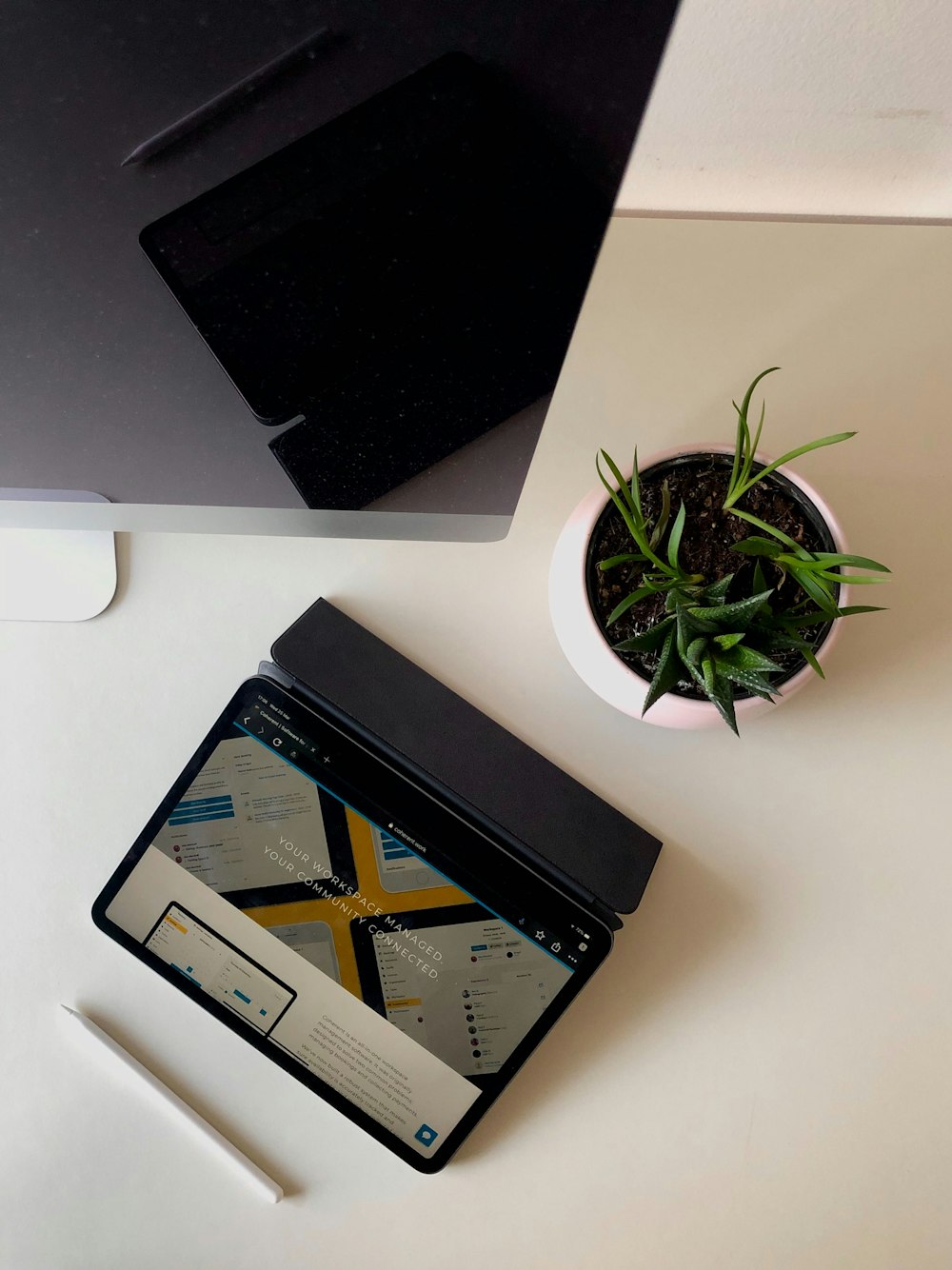 black ipad on white table