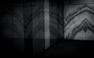 Restored marble floor in a villa hallway glowing warmly under ambient lighting.