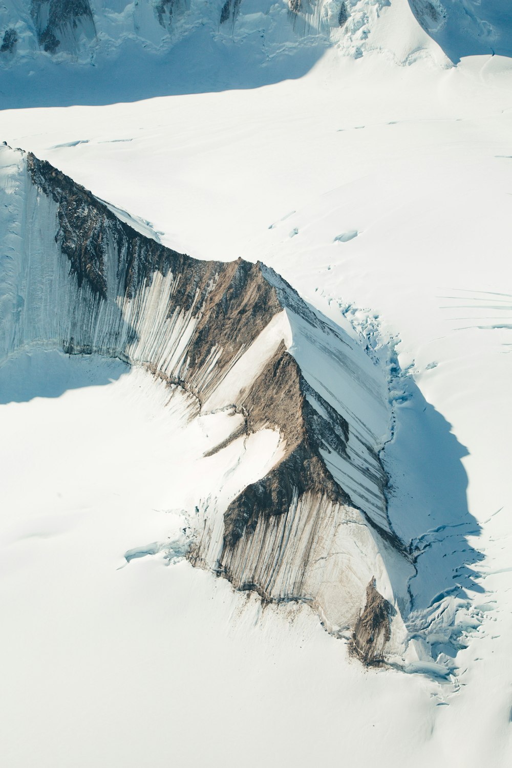 snow covered mountain during daytime