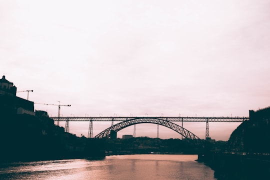 gray concrete bridge under white sky in Dom Luís Bridge Portugal