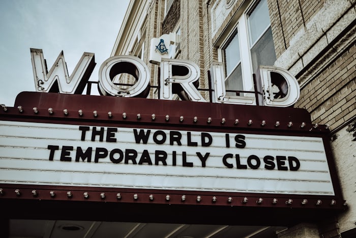 Theatre sign saying the world is temporarily closed