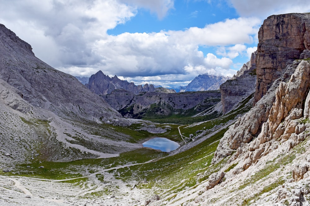 green and gray mountains under white clouds during daytime