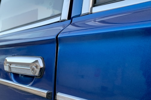 Before and after images showing a restored car door with flawless paint.