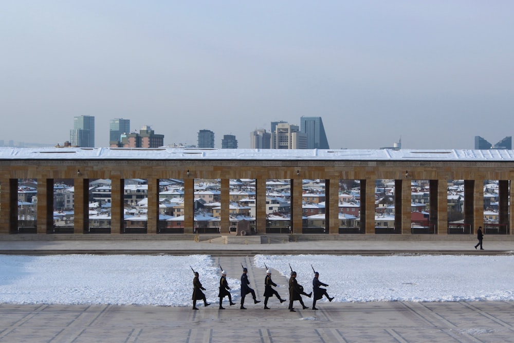 people walking on street near brown concrete building during daytime