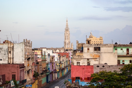 white and red concrete buildings during daytime in La Habana Cuba