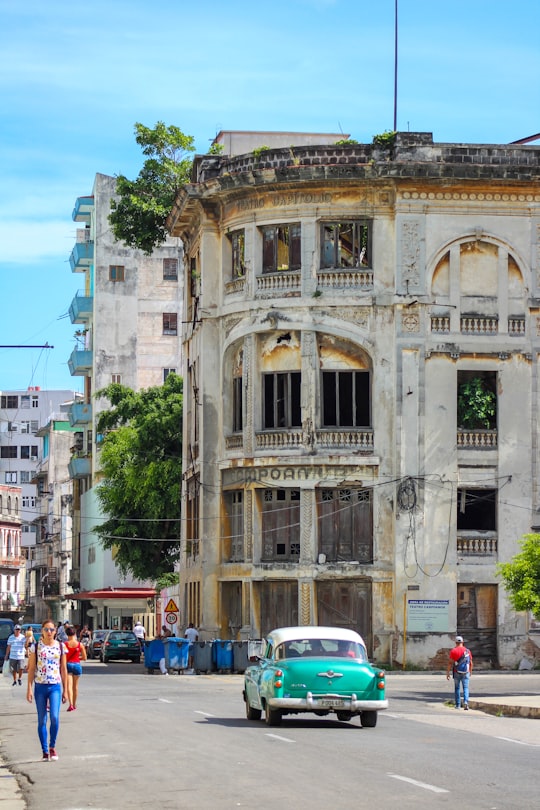 cars parked in front of brown concrete building during daytime in La Habana Cuba