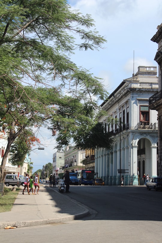 people walking on sidewalk near building during daytime in La Habana Cuba