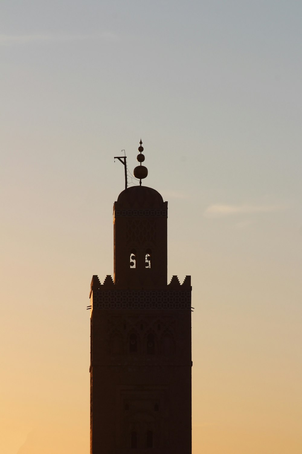 silhouette of man standing on top of building