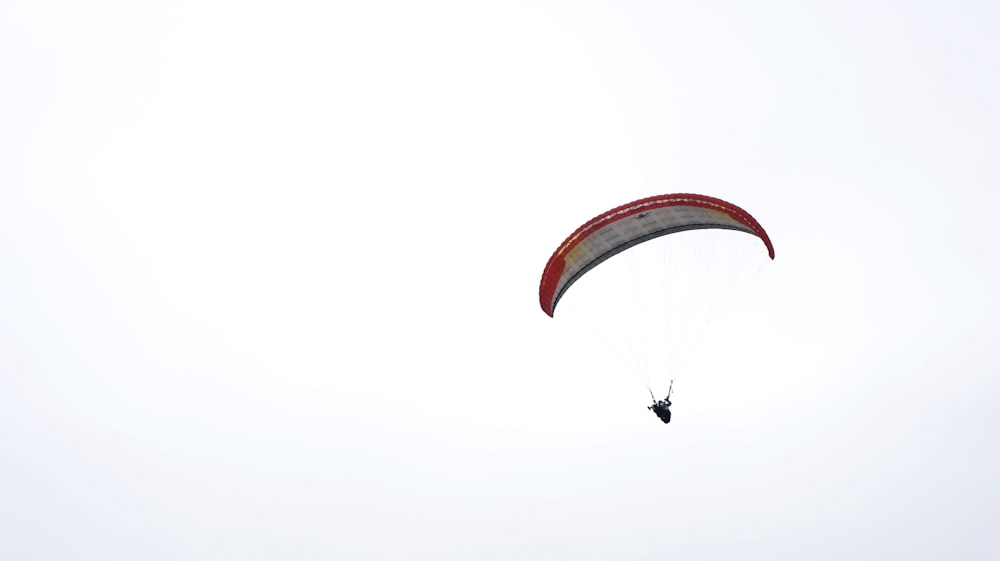 person in red and blue parachute