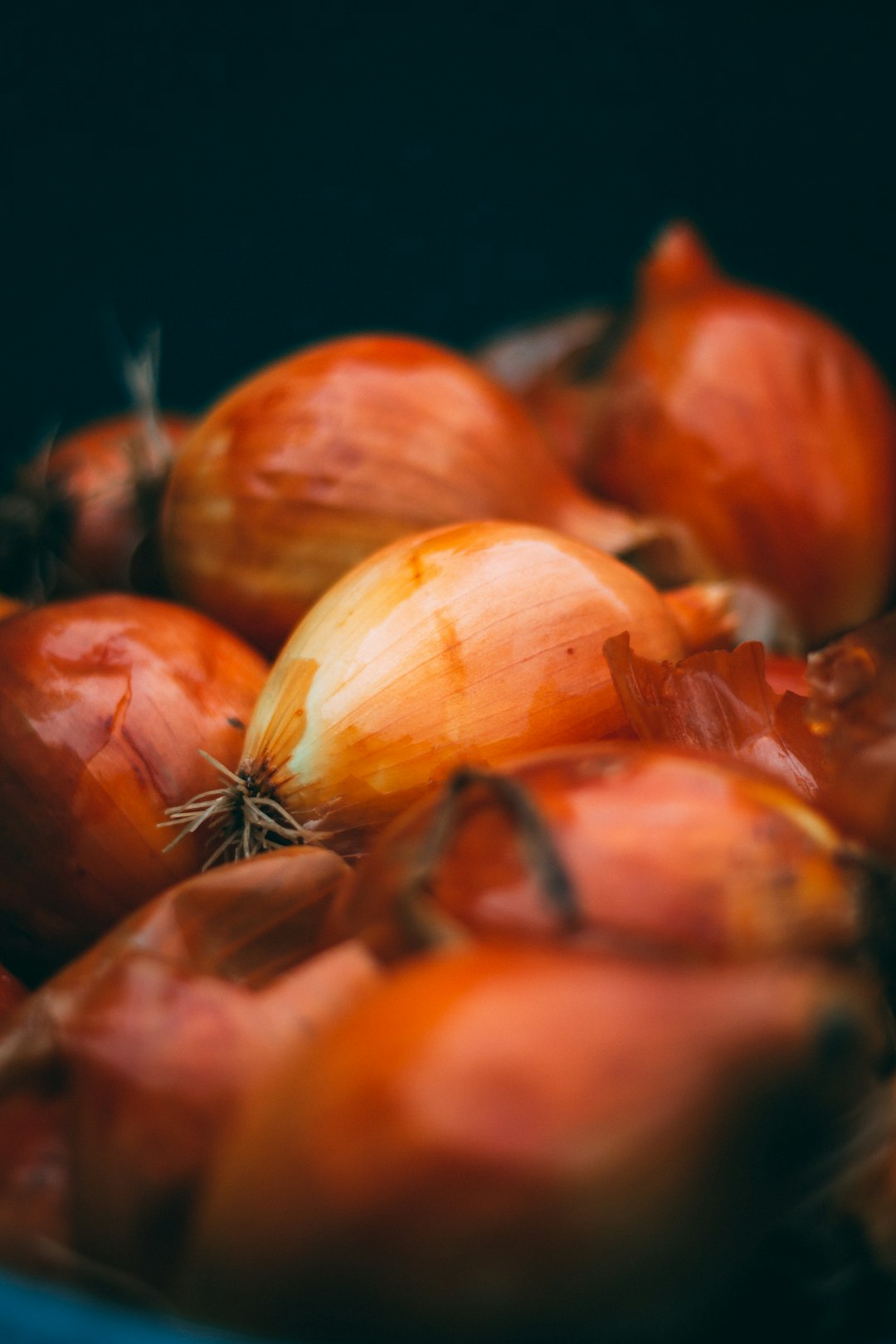 garlic and red chili on black surface